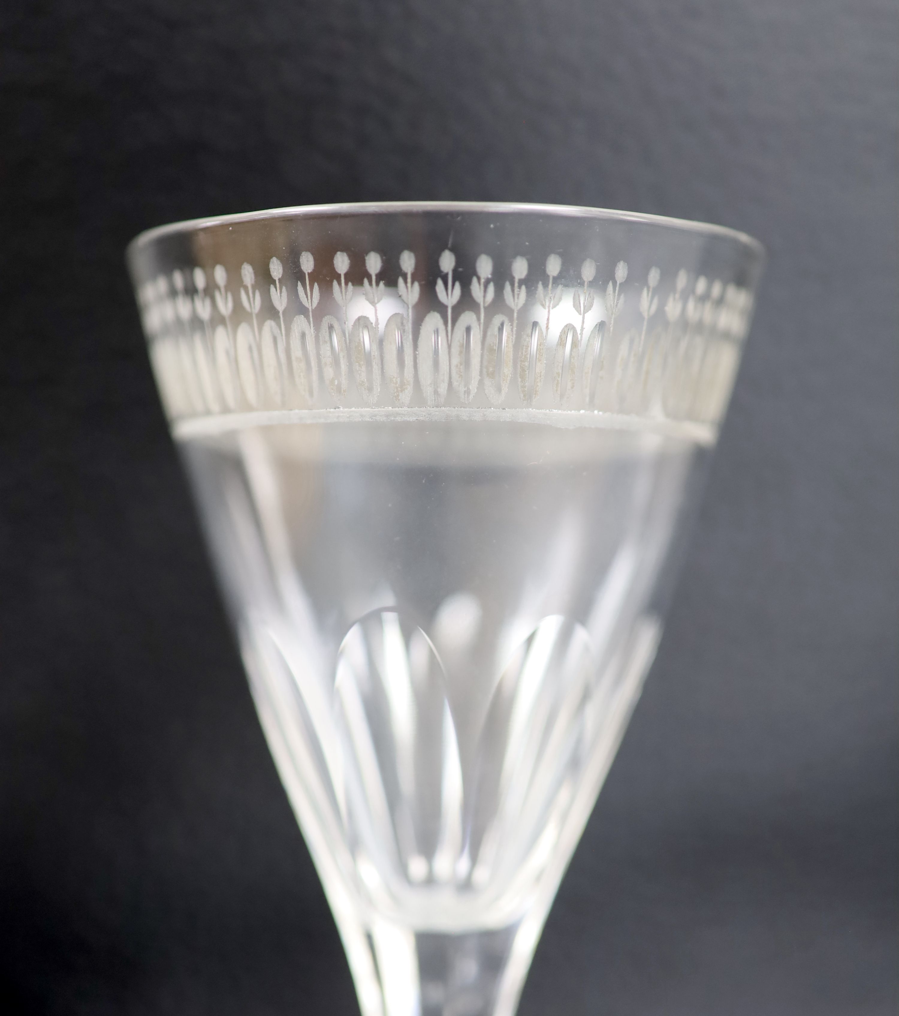 A silver collared cut glass decanter and a glass scent bottle with 800 standard silver stopper, tallest 27cm and a set of 5 etched wine glasses.